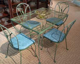 Woodard wrought iron table with four chairs
New glass top
At a bargain price