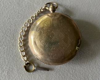 Large antique gold-plated pocket watch.