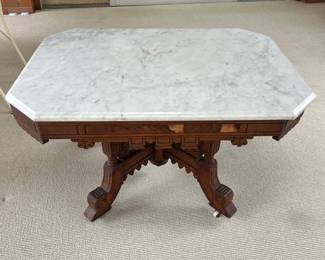 Eastlake coffee table with marble top.