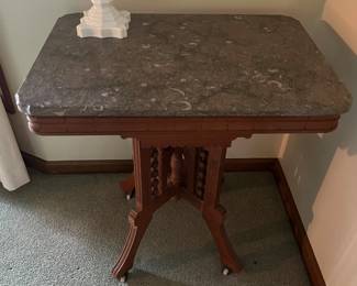 Eastlake coffee table with marble top.