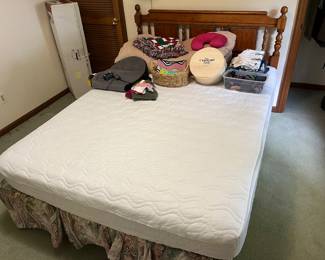 Queen-size bed with mattress and box spring.
