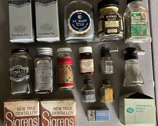 Vintage dentistry advertising including bottles and boxes.