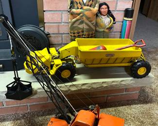 Vintage Doepke Model Toys earth mover; Doepke Model Toys unit crane; two Skookum Native American dolls.