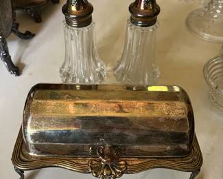 Antique silver-plated roll-top butter dish; large antique glass salt and pepper shakers with silver-plated tops, made in England.