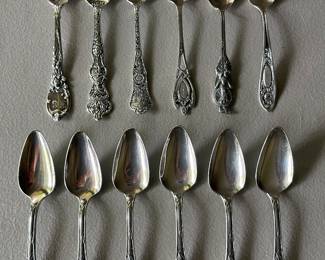 Sterling silver spoons, including some souvenir spoons.