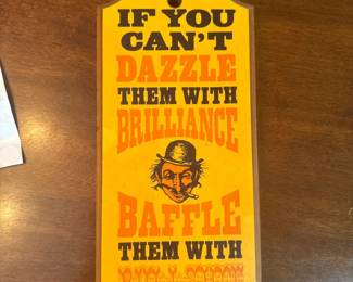 "IF you can't dazzle them with brilliance...." sign by W.C. Fields