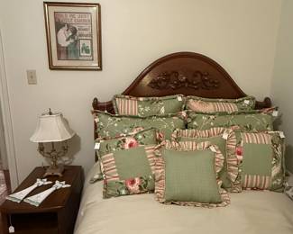 Lovely bedding and carved full size bed