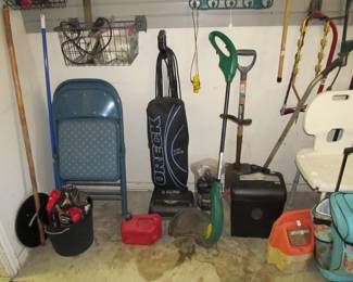 A full garage with hand tools, yard tools, and more!
