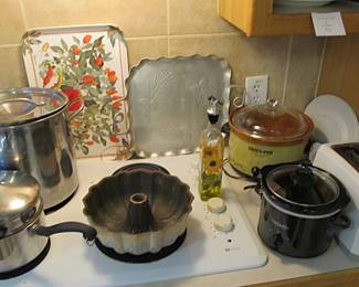 We have a great kitchen full of goodies! Small appliances include Mr Coffee, Oster, and a Crock Pot. Corningware, bakeware, serving platters, cookware, kitchen utensils, knives, dinnerware, glassware, and more.
