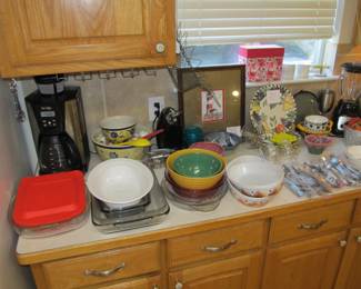 We have a great kitchen full of goodies! Small appliances include Mr Coffee, Oster, and a Crock Pot. Corningware, bakeware, serving platters, cookware, kitchen utensils, knives, dinnerware, glassware, and more.