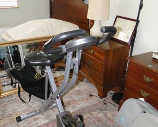 Four poster bed, and exercise equipment too