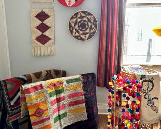 Berber and Indigenous American woven baskets, assorted vintage textiles and rugs