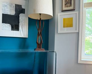 Teak lamp. CB2 Peekaboo acrylic table.