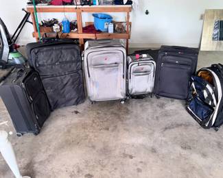 Lot of Rolling Luggage Travel Bags