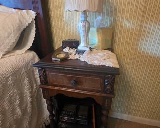 Night stand in next to bed in antique bedroom