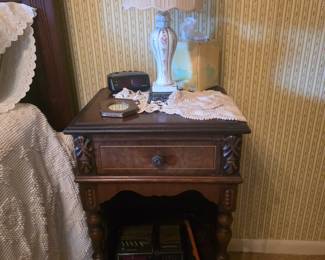Antique end table to queen bed -mlamp & crochet doilies