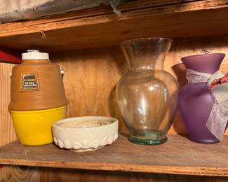 Outside storage building in back yard - 1/2 gallon container, planter & flower vases