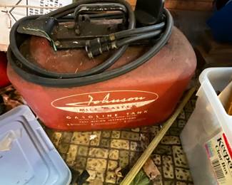 Outside storage building in back yard - Johnson  outboard motor gas can
