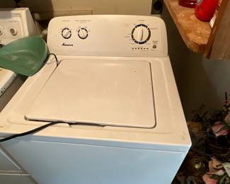 Outside laundry room with storage - Amana Washer - works