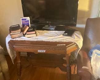 Living room - TV, free bibles  -  this table is NOT for sale