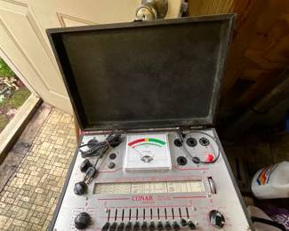 Outside storage building in back yard - tube tester in case