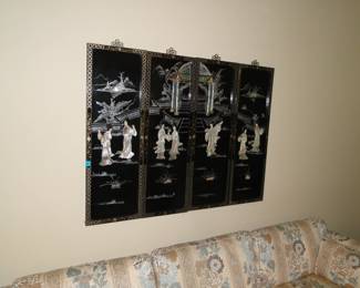 This four panel, Oriental inspired piece is breathtaking. The hand carved detail is remarkable