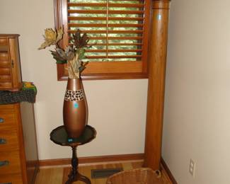 Another tall spool. Vase and round table