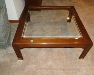 A good 1980's nod to the oriental inspired coffee table that just happens to be glass topped