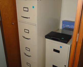 File cabinets, one on the left is tall, and the one on the right is short. Kinda like the twins movie