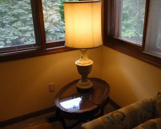 And then twilight came back and the lamp turned on and the glass top oval table shone in the light