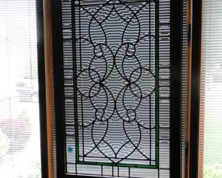 This is what an outstanding piece of stained glass looks like with the blinds down