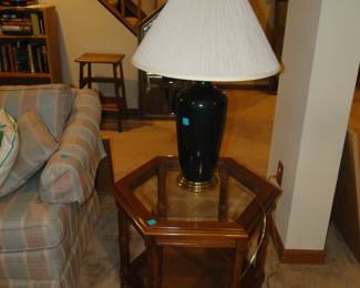 Six sided glass topped table with beautiful lamp on top