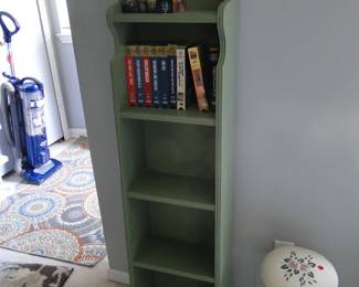 VHS tapes, and an oversized shelf, perfect for trinkets, and or books, or a great cabinet for the kitchen to hold spices