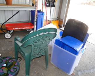 Plastic chairs and plastic bins, and a Roadmaster Wagon in the background