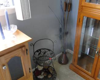 Metal basket, vase, and cattails