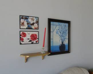 Wall art and wall shelf.  Highly recommend not lighting the tilted candle