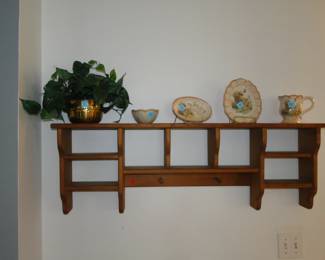 Wall shelf with decorative items