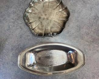 Silver plated serving dishes.