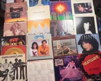 Vinyl Record Albums 70’s A diverse collection of vintage vinyl records from the 1970s, including artists like Earth, Wind & Fire, Minnie Riperton, The Carpenters, Marshall Tucker Band and more. Perfect for collectors and music enthusiasts. See pictures for more details.