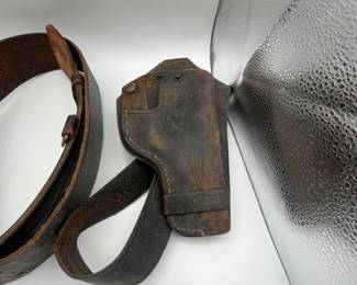 This is a fun lot for gun collectors. There is a vintage Police Officer belt with holster, a second holster, an NRA belt - 43” to the first hole, tooled leather belt is adjustable. We included a couple of fun vintage bookends/chess figure to round out the collection.
See items descriptions and photos for condition details.