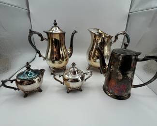 Five-piece silver plated set consisting of a teapot, coffee pot, cream pitcher, sugar bowl, and covered sugar bowl. Perfect for vintage decor or entertaining.
See items descriptions and photos for condition details.
