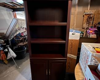 Beautiful bookshelf with doors. Very good condition.