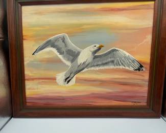 Original artwork featuring a seagull soaring at Sunset.