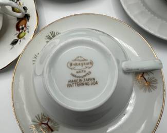 This is a beautiful lot for a tea party! A set of four white tea cups and saucers, a tea pot and three unique cups and saucers. Also included is a small crystal trinket dish.
See items descriptions and photos for condition details.