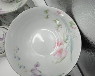 Couture Fine China “Bouquet” Pattern. Complete set of vintage porcelain dinnerware featuring floral patterns. Includes dinner plates, tea cups, saucers, cream jug, sugar bowl, and serving dishes. Service for eight, perfect for bridal showers, weddings and other gatherings.
See items descriptions and photos for condition details.
