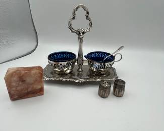 Beautiful vintage condiment server made of white metal and cobalt glass, made in England. Also included is a very unique marble salt and pepper shaker, one piece with salt on one side and pepper on the other. Finally, an antique miniature salt and pepper shaker set measuring at .26ozt. Don’t let this beautiful lot slip by!
See items descriptions and photos for condition details.