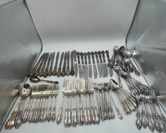 88 pieces of silver-plated and stainless flatware including knives, forks, and spoons. This is a large collection of coordinating flatware, perfect for large parties!
See items descriptions and photos for condition details.