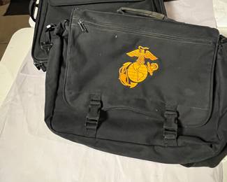 Set of two bags, messenger bag with the Marine Corps EGA emblem and a black laptop bag.