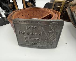 This is a fun lot for gun collectors. There is a vintage Police Officer belt with holster, a second holster, an NRA belt - 43” to the first hole, tooled leather belt is adjustable. We included a couple of fun vintage bookends/chess figure to round out the collection.
See items descriptions and photos for condition details.