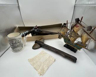 This is a fun lot that includes a collectible Flint Lock replica pistol (non operational), a Tomahawk and a model of the Mayflower. Also included is a fun stein with a sea faring scene and a little lace handkerchief. Perfect collection for the era of the founding of the United States of America.
See items descriptions and photos for condition details.